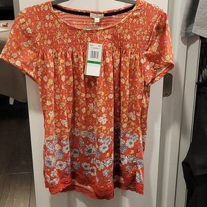 Floral top with smocking on top of shirt